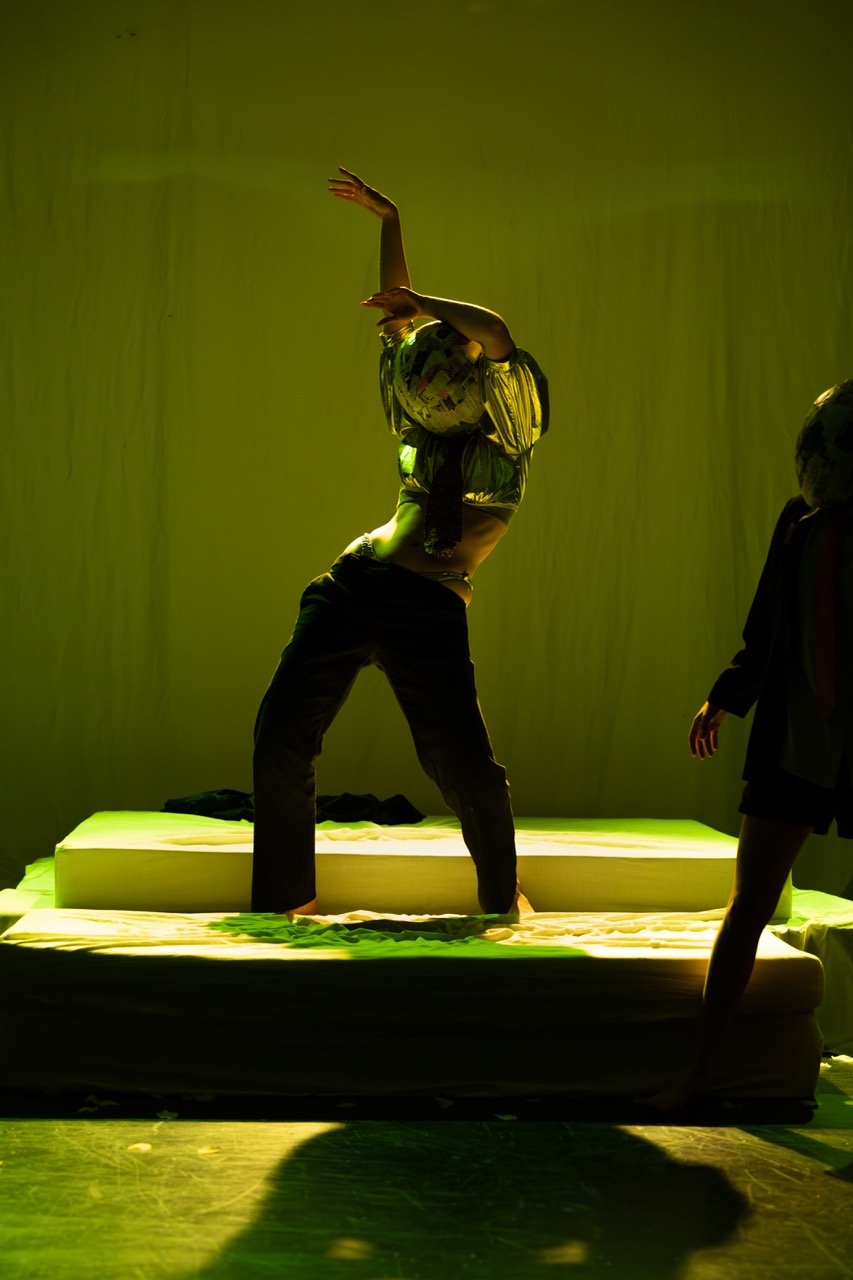 Fran Sweeney-Nash in green light and paper-mache head in Peach Blossom Fan