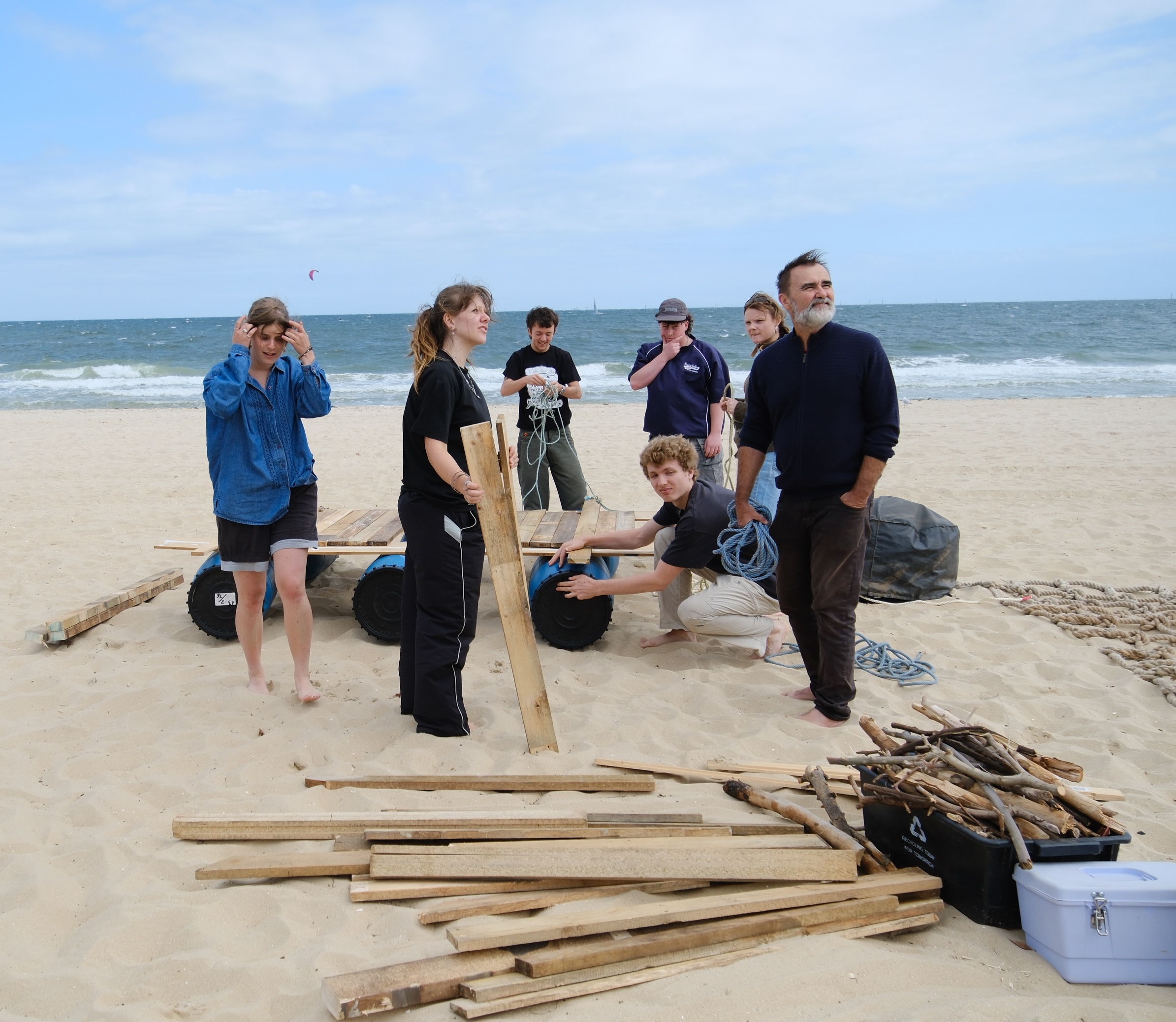 A motley group of raft builders working on their raft.